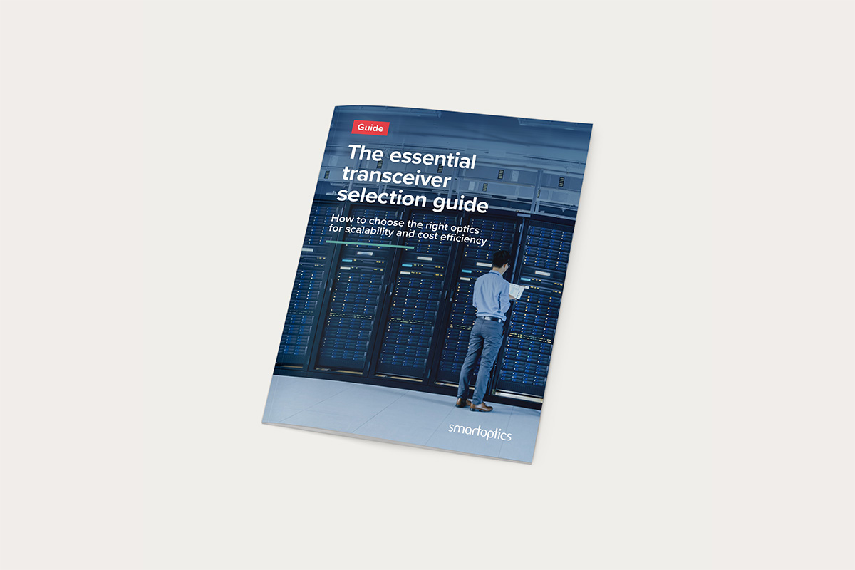 Booklet titled "The essential transceiver selection guide" with a person standing by server racks.